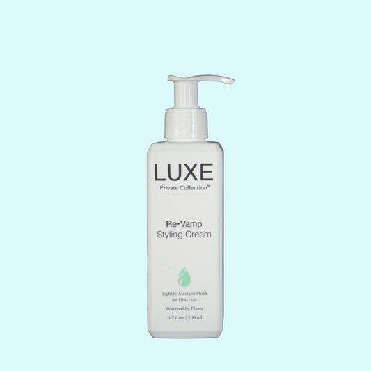 LUXE Re-Vamp Styling Cream bottle on a light blue background